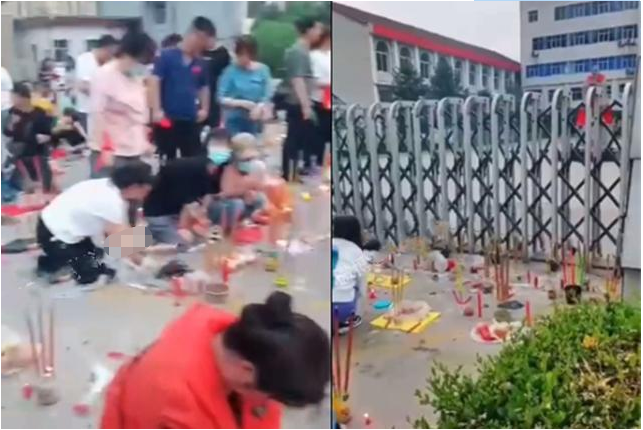 “临时抱佛脚”:山西家长在考场外烧香跪拜